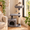 Cat tree kucing warna abu-abu 3 tingkat dengan rumah kucing, scratching post, platform bertingkat, dan tempat tidur bulat di dekat jendela, digunakan kucing untuk bersantai.